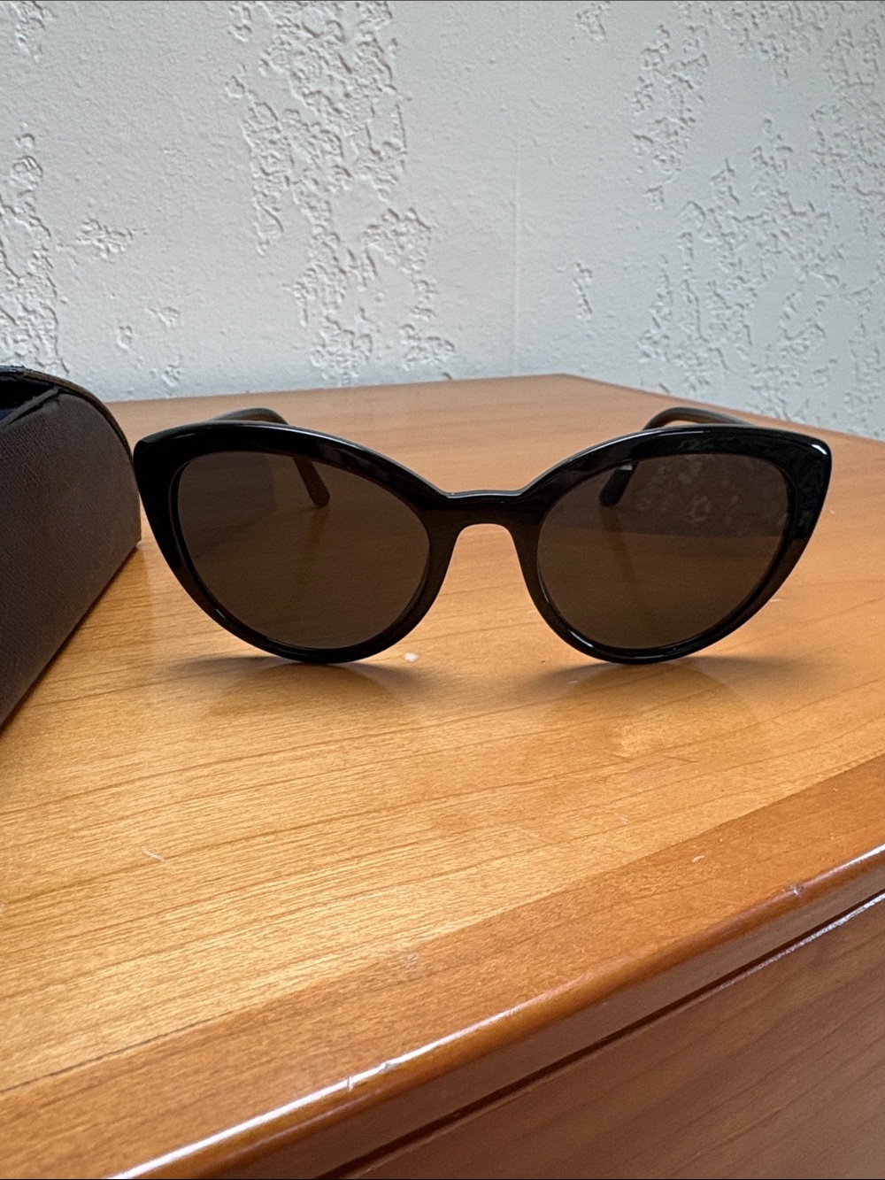 Prada SPR02V CATWALK cat eye sunglasses, black with black lenses.